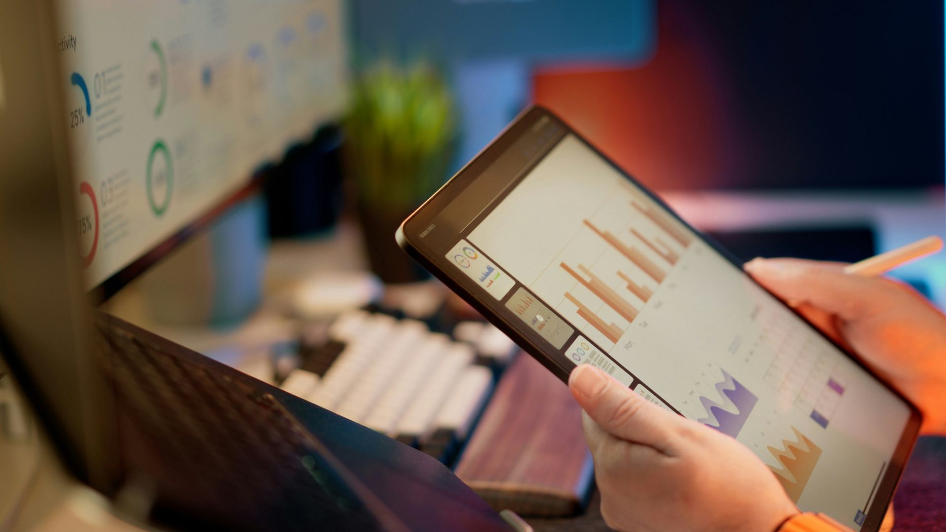 Analyst reviewing financial dashboards on a tablet
